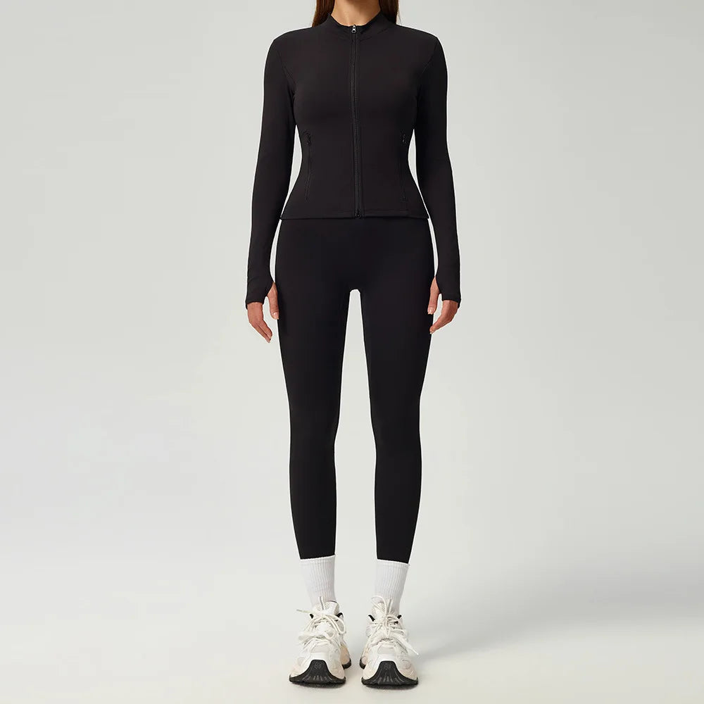 Black 2-piece women's sports set by Corporación Turística featuring a comfortable athletic top and matching leggings.