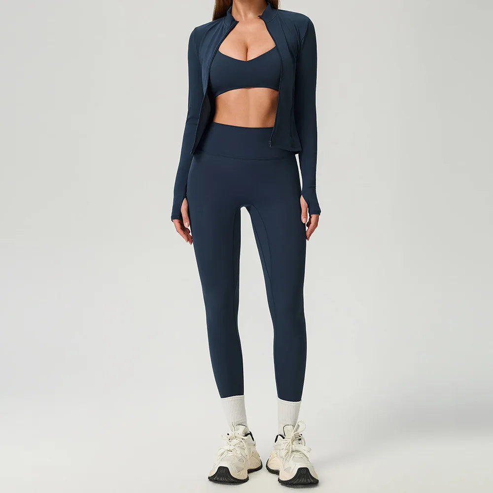 Black 2-piece women's sports set by Corporación Turística, includes a fitted top and matching athletic pants for active wear.