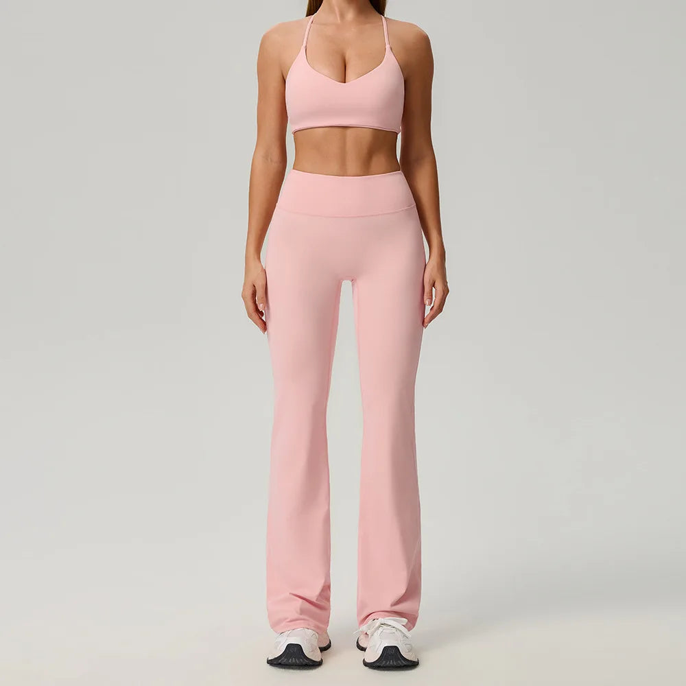 Black 2-piece women's sports set from Corporación Turística, featuring a comfortable athletic top and matching leggings.
