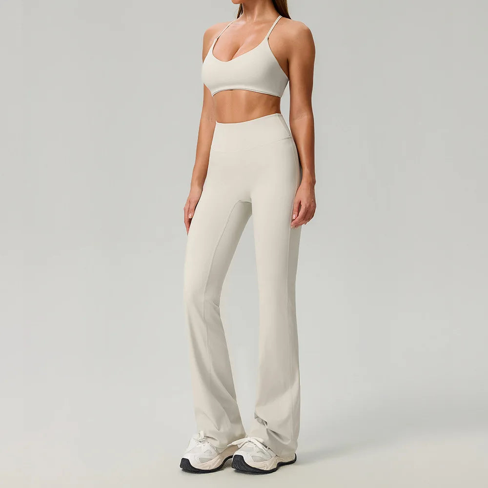 Black 2-piece women's sports set by Corporación Turística, includes a fitted athletic top and matching leggings.