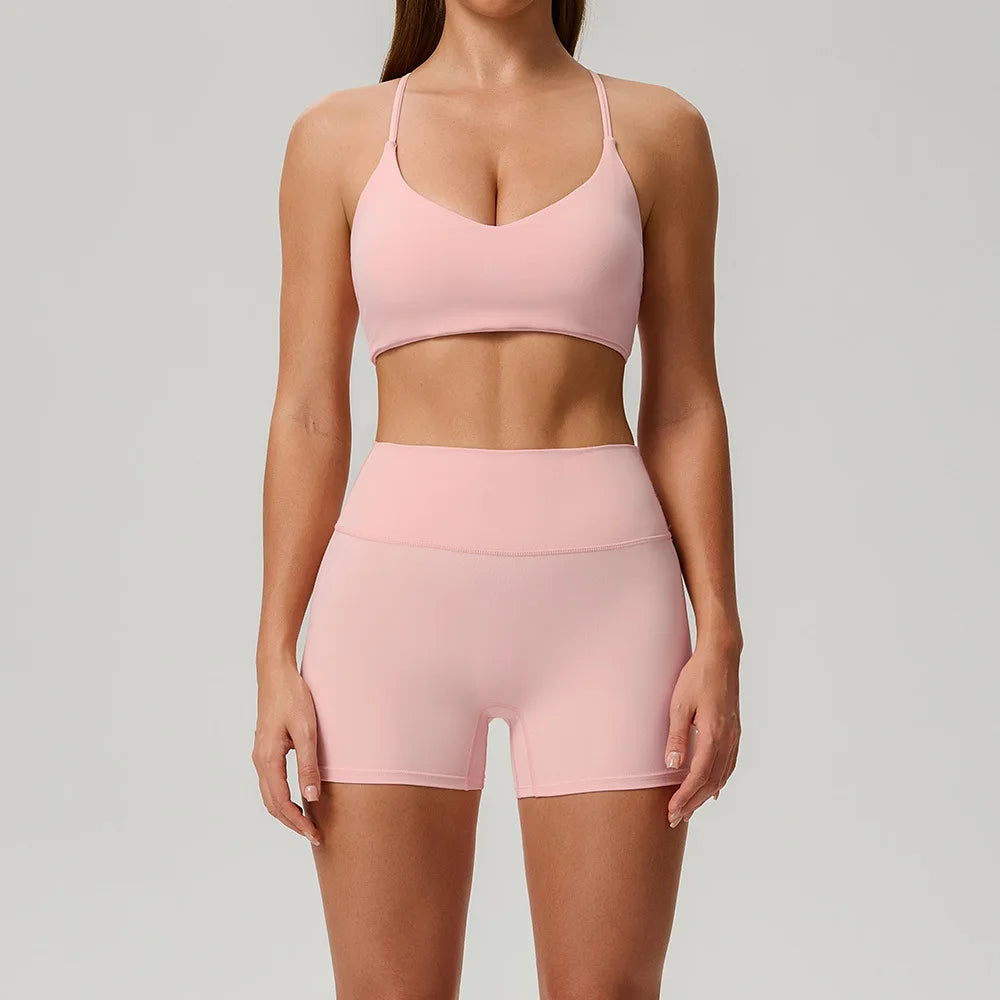 Black 2-piece women's sports set by Corporación Turística, includes a sports top and leggings for athletic activities.