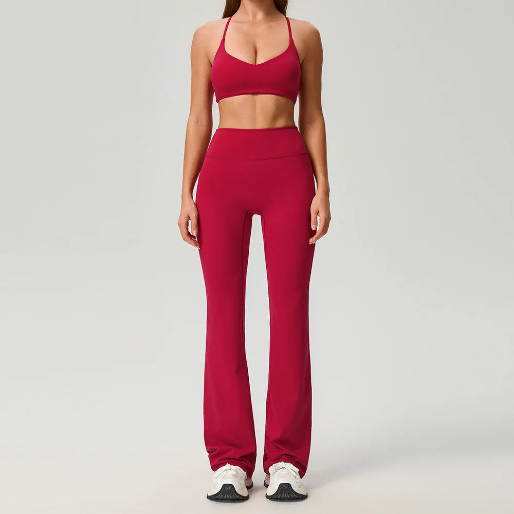 Black women's 2-piece sports set by Corporación Turística, includes a fitted top and matching leggings for active wear.