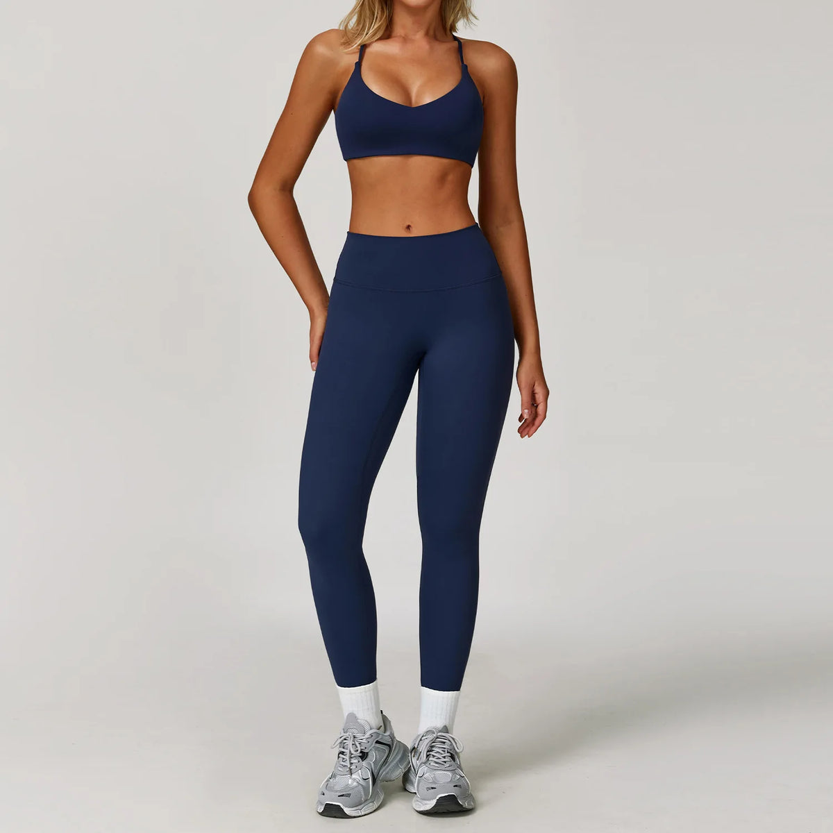 Black 2-piece women's yoga set by Corporación Turística, includes a sports bra and leggings for active wear.