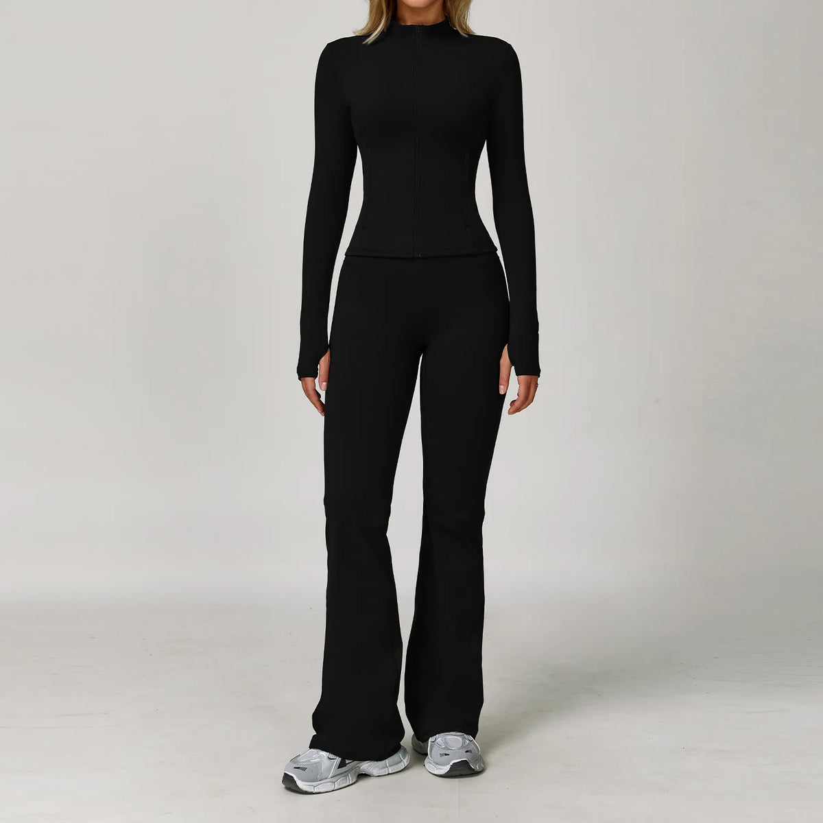 Black women's yoga set with 2 or 3 pieces from Corporación Turística, featuring comfortable sportswear for active wear.