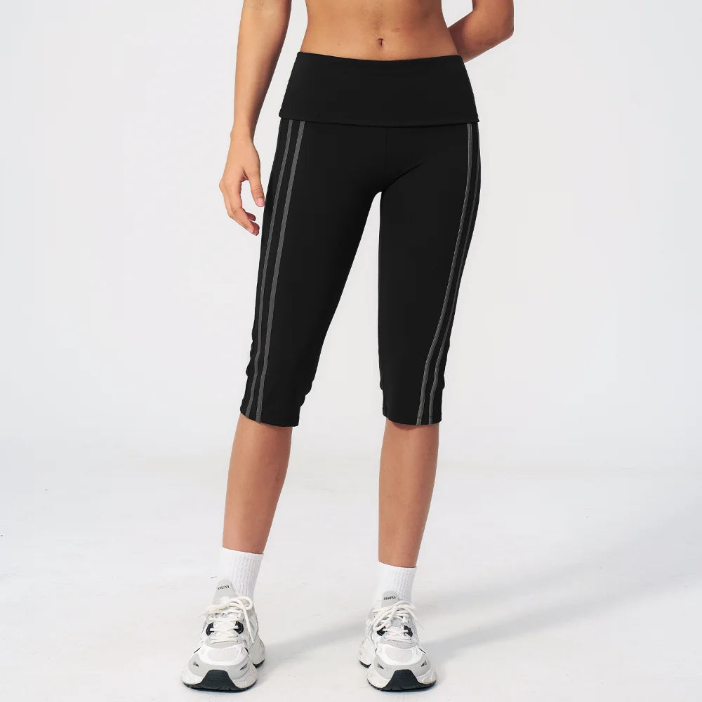 Black high-waist yoga pants for women by Corporación Turística, made of stretchy material, designed for comfort and flexibility.