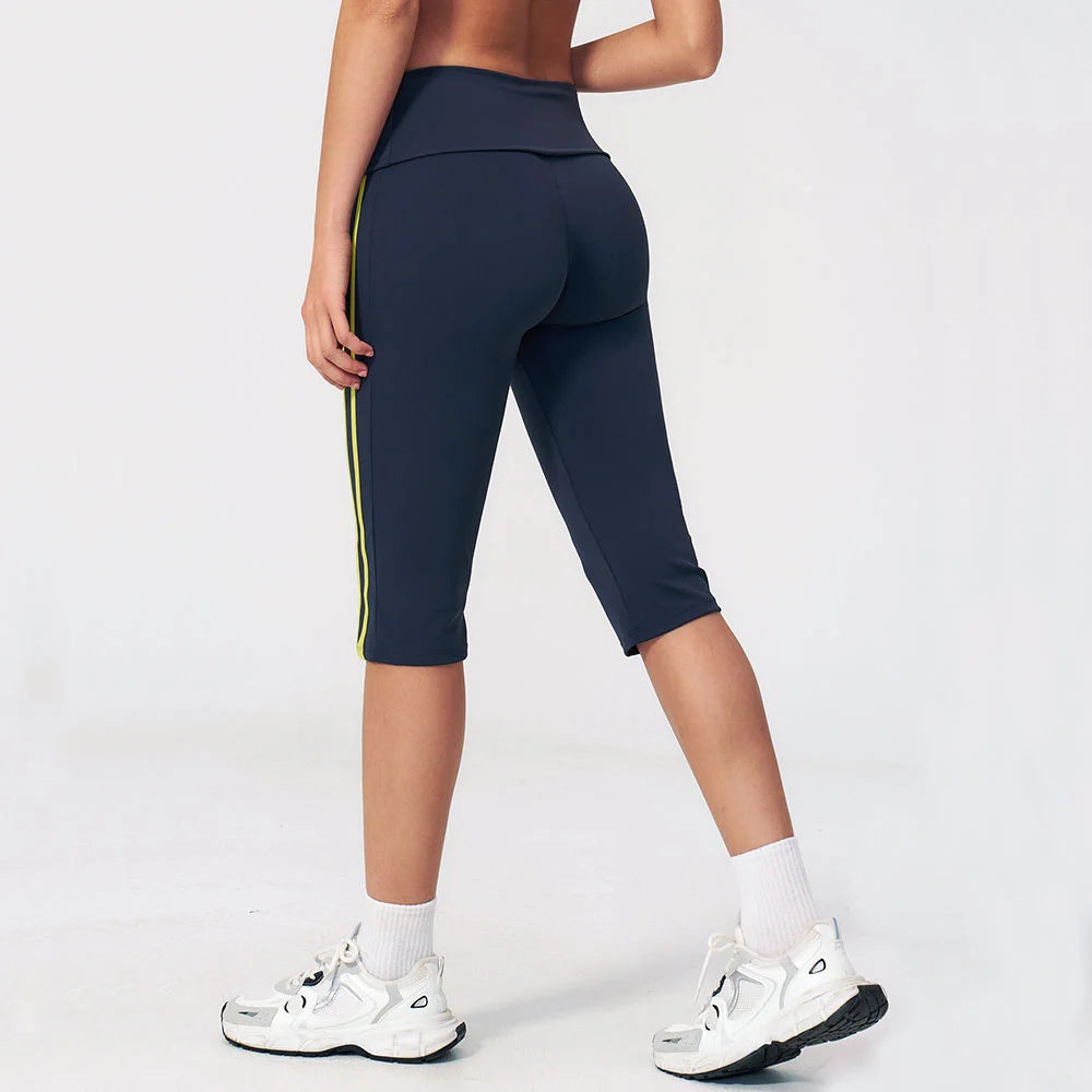 High-waisted yoga pants for women by Corporación Turística in black, featuring a fitted design and comfortable stretch fabric.