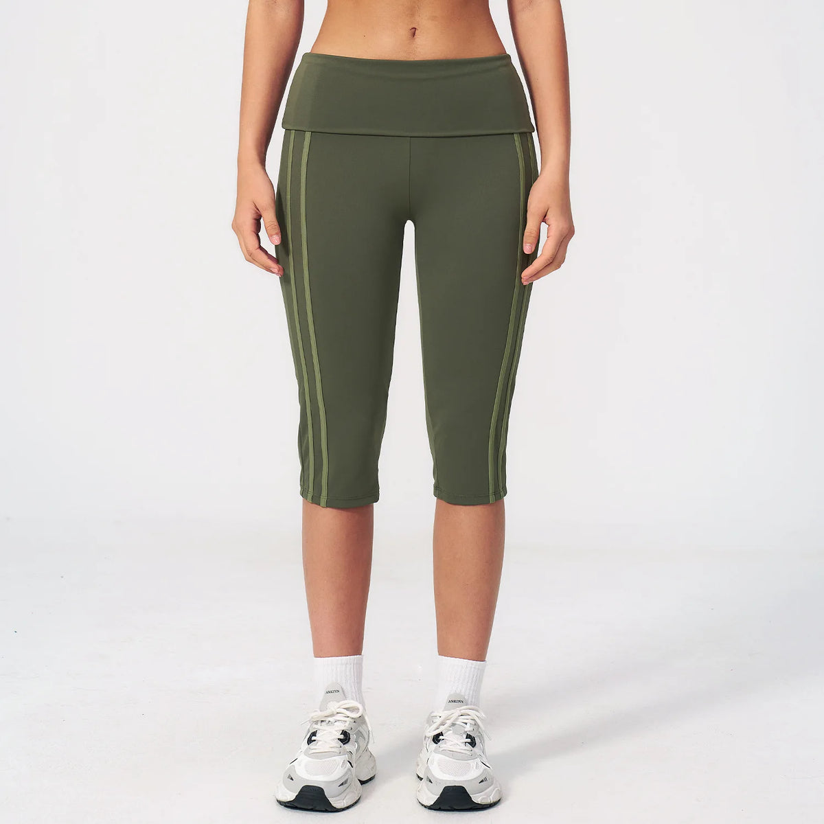 High-waisted women's yoga pants by Corporación Turística in black, shown on a model, highlighting comfortable fit and stretch fabric.