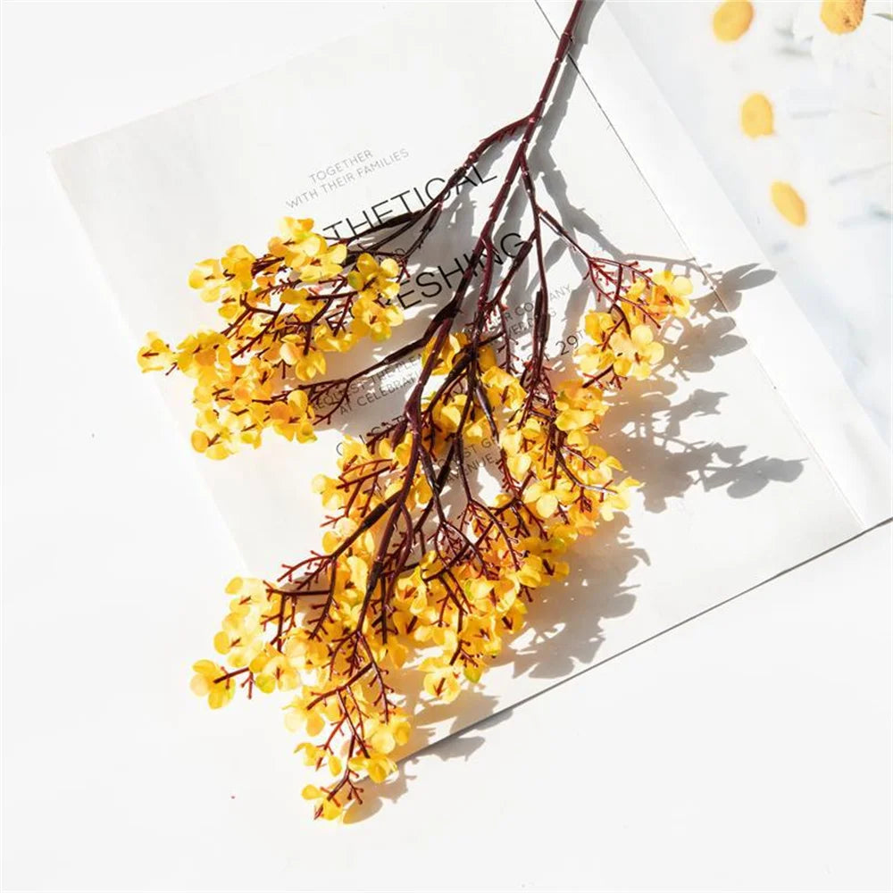 Pair of purple artificial Gypsophila flowers from Corporación Turística, realistic faux floral arrangement for home decor.