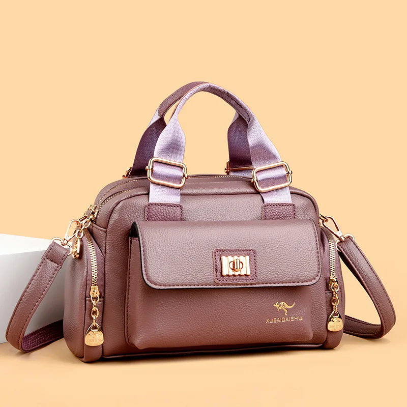 Purple luxury designer shoulder bag and matching clutch from Corporación Turística, stylish accessories with elegant details.