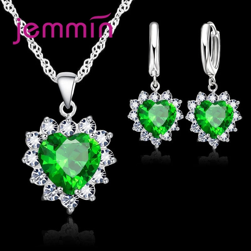 Purple jewelry gift set from Corporación Turística, featuring matching earrings and necklace for anniversary or special occasions.