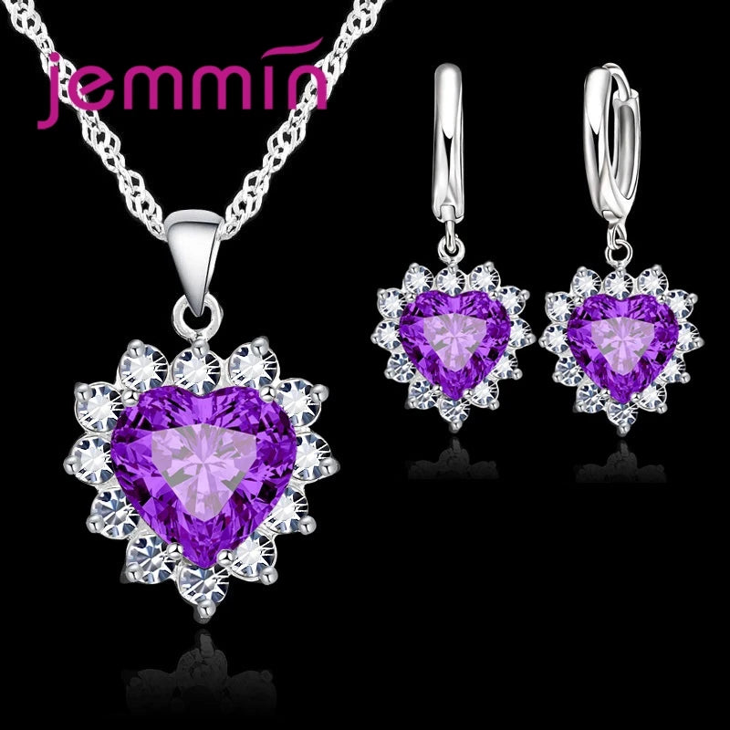 Purple jewelry gift set from Corporación Turística, featuring coordinated necklaces and earrings for special occasions.