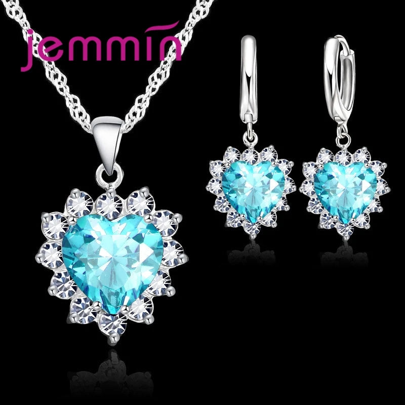 Purple jewelry gift set featuring necklaces and earrings from Corporación Turística, perfect for anniversary celebrations.