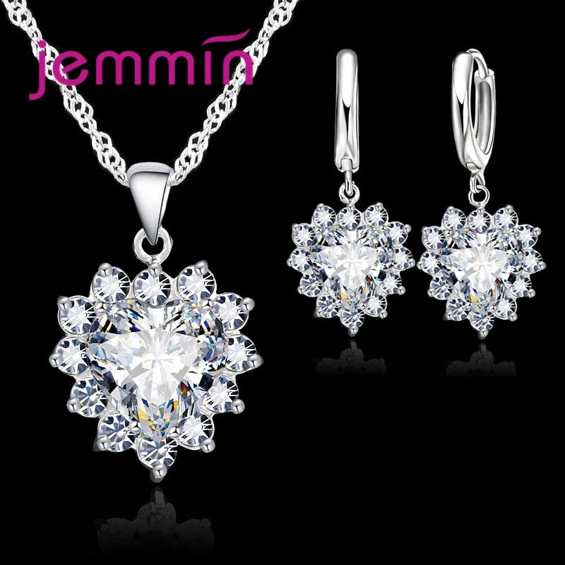 Purple jewelry gift set from Corporación Turística featuring coordinated necklace and earrings for anniversary celebrations.