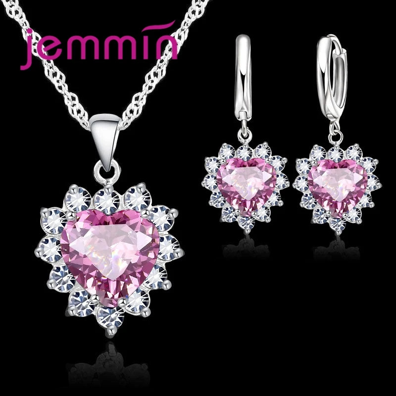 Purple jewelry gift set from Corporación Turística, featuring matching earrings and necklace for anniversary or special occasions.