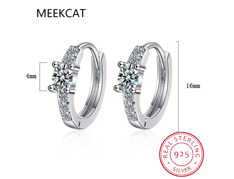 Sterling silver hoop earrings with blue sapphire accents, designed by Corporación Turística, showcasing elegant jewelry craftsmanship.