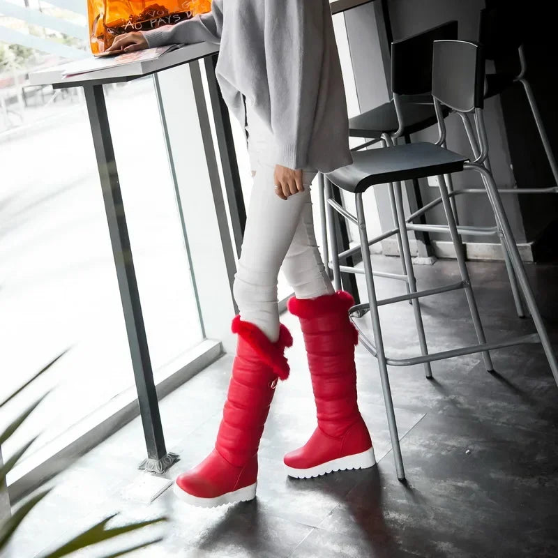 Knee-high snow boots by Corporación Turística with warm fleece lining and leather exterior for winter protection.
