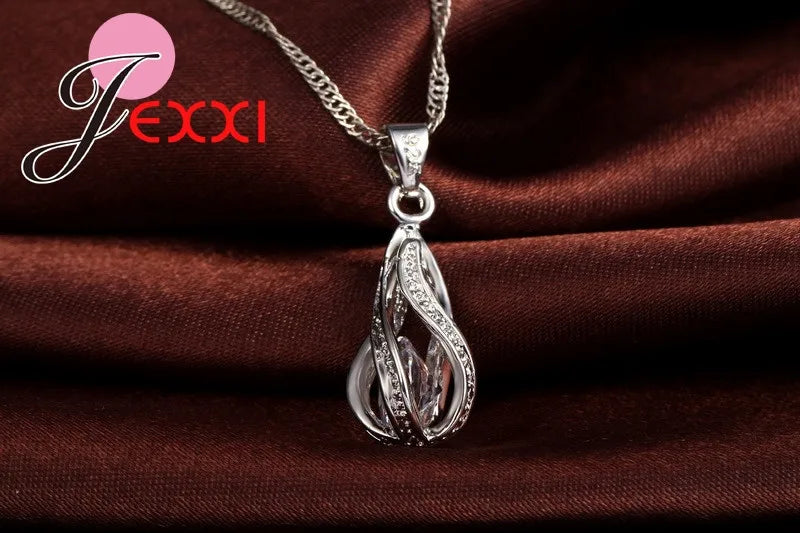 Gold-plated CZ 925 sterling silver jewelry set with water drop design, featuring earrings and pendant for elegant style.