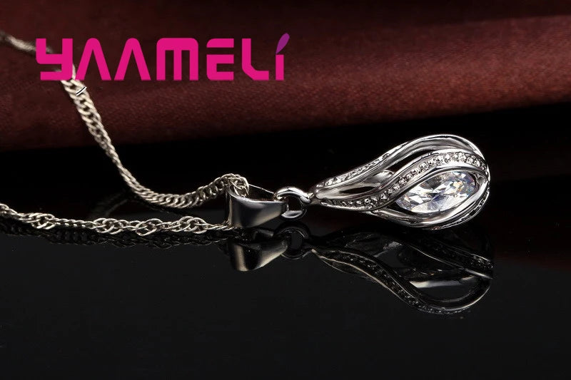 Gold-plated CZ 925 jewelry set featuring a water drop design, including necklace and earrings, by Corporación Turística.