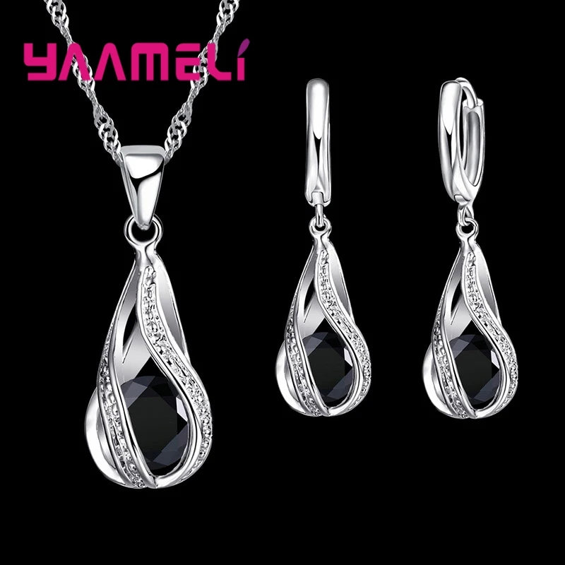 Gold-plated CZ 925 silver jewelry set featuring a water drop design, including earrings and necklace, by Corporación Turística.