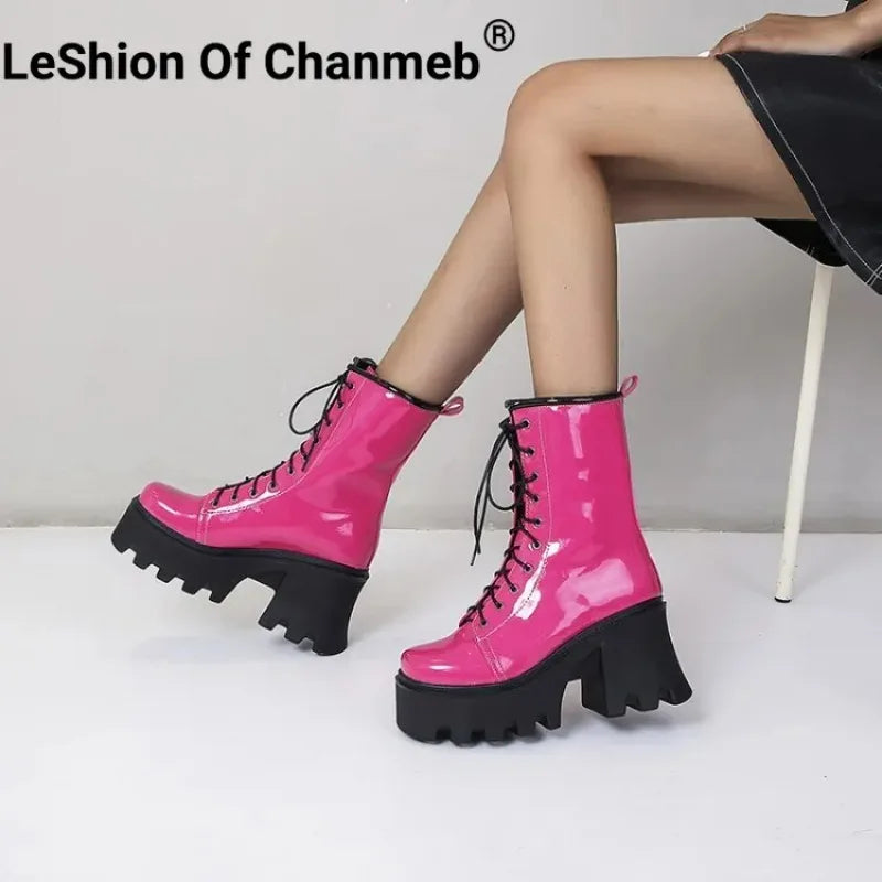 Red gothic punk boots for women by LeShion of Chanmeb, featuring black platform heels and lace-up design, stylish and edgy footwear.