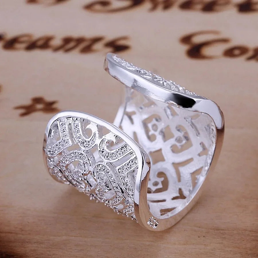 Silver 925 sterling ring from Corporación Turística, showcasing a sleek, shiny band with a smooth finish.