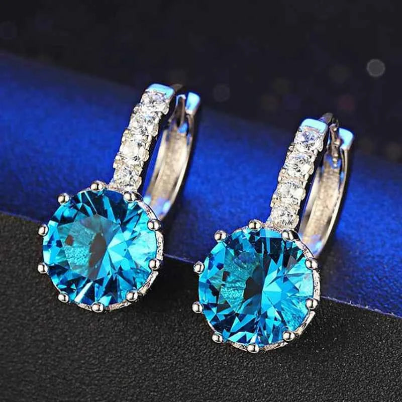 Red circular cubic zirconia hoop earrings for women by YAAMELI, featuring sparkling gemstone accents and gold-tone finish.