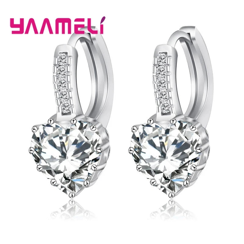 YAAMELI circular hoop earrings with cubic zirconia for women, featuring sparkling red stones, from Corporación Turística.