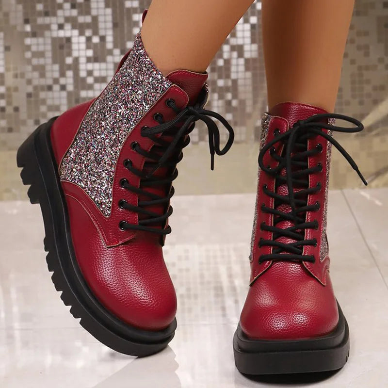 Bright red retro women's boots with shiny finish and lace-up design, stylish ankle booties from Corporación Turística.