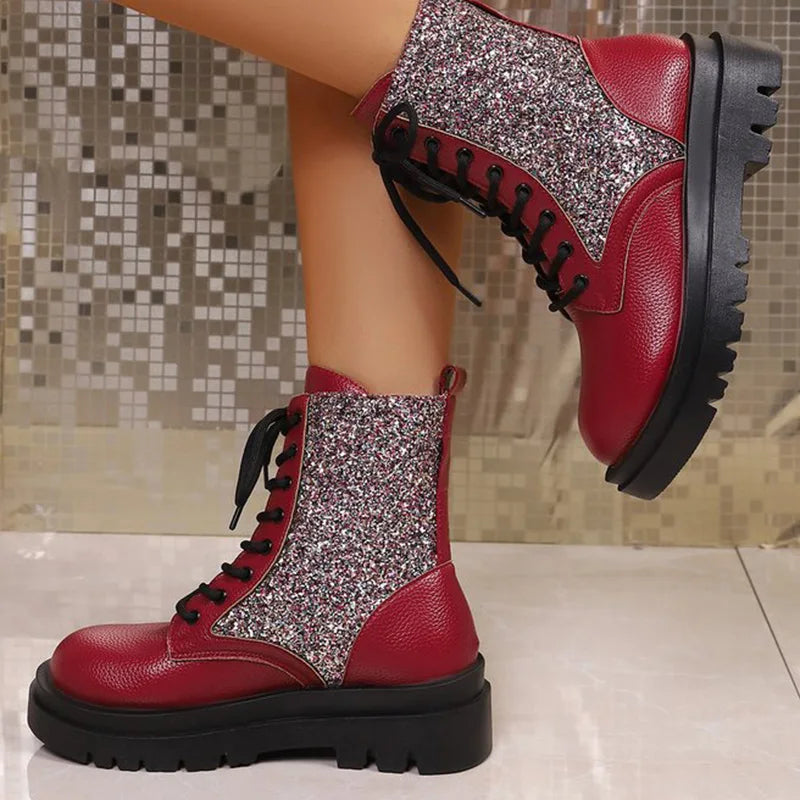 Bright red retro women's ankle boots with shiny finish and lace-up detail, stylish footwear by Corporación Turística.
