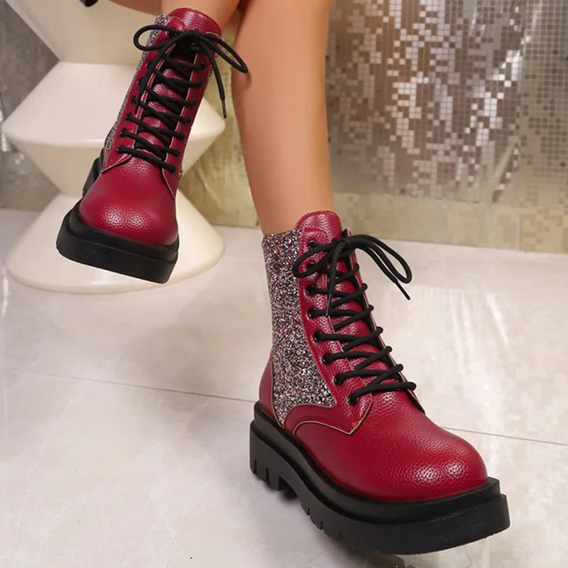 Bright red retro women's boots with shiny finish and lace-up design from Corporación Turística.