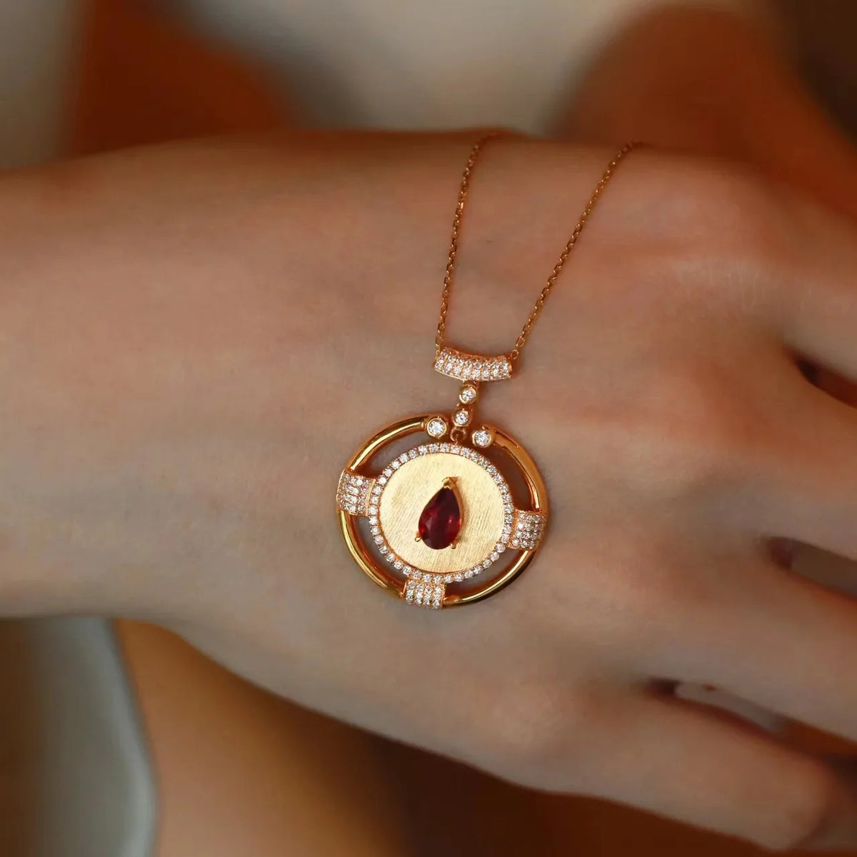 14K rose gold pendant with a 2-carat gemstone for women, featuring a vibrant red gem and elegant design.