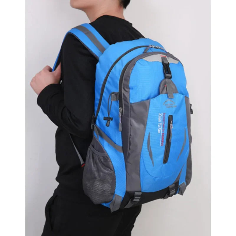 Red high-quality nylon waterproof travel backpack by Corporación Turística showing multiple compartments and padded shoulder straps.