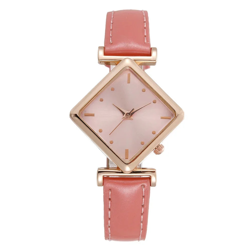 Elegant women's quartz watch with a diamond-shaped pointer and red strap, showcasing a sophisticated design by Corporación Turística.