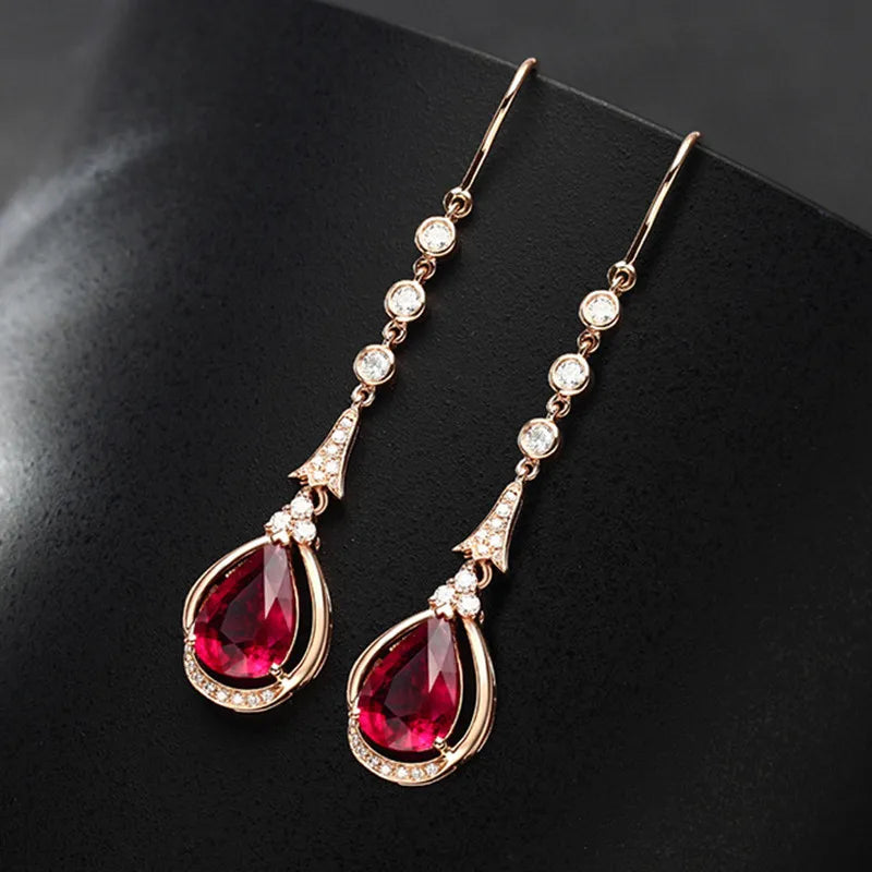 Rose gold 18k ruby drop earrings featuring natural rubies, elegant and handcrafted jewelry from Corporación Turística.