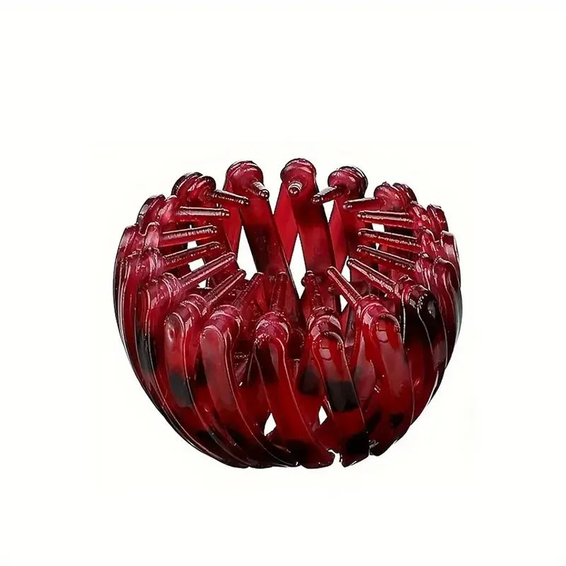 Red fashion bird’s nest hair clip from Corporación Turística, stylish and functional for securing hair.