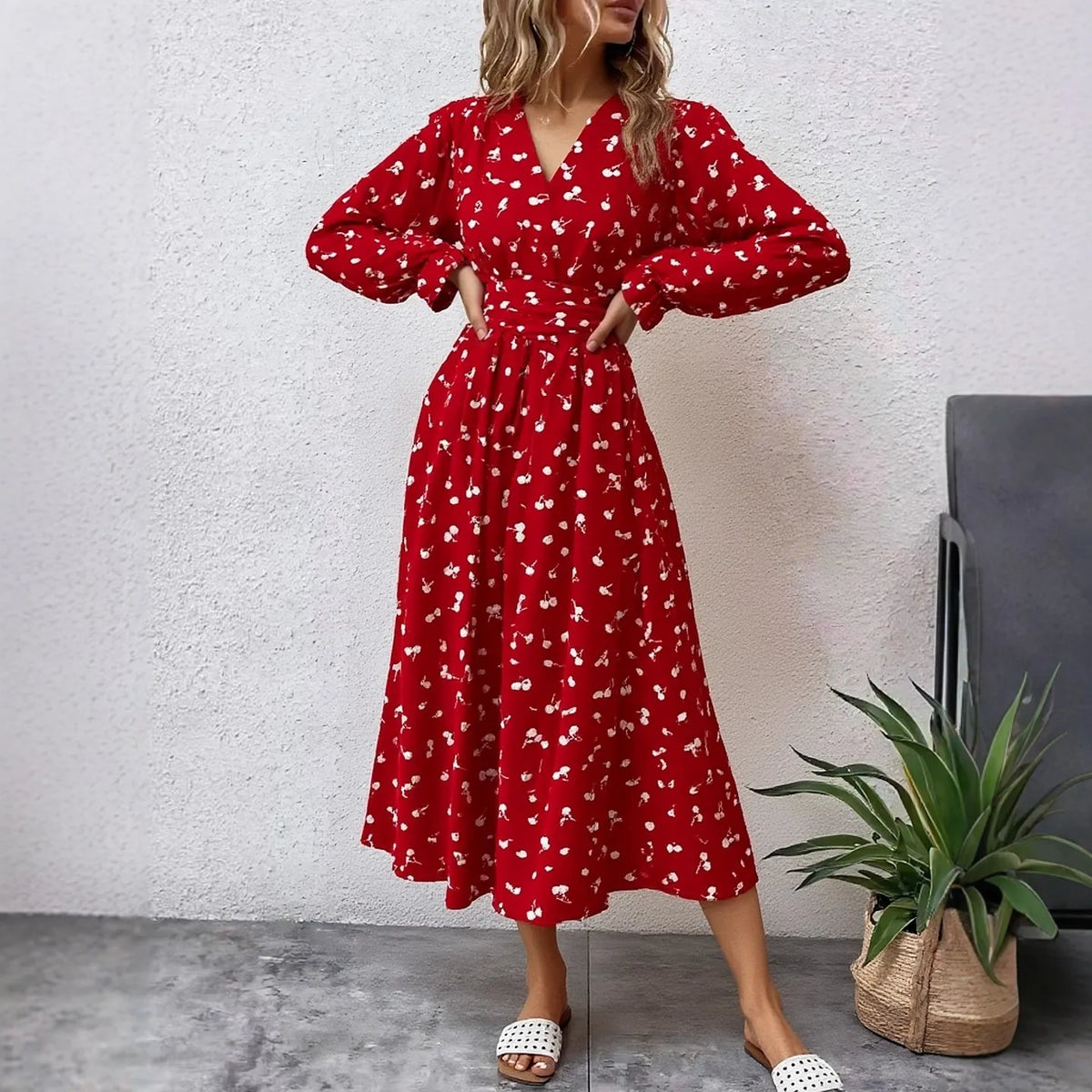 Long red women's dress by YuooMuoo, featuring a flowing design, perfect for spring 2026 fashion.