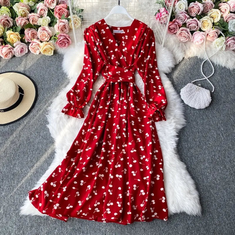 Long women's dress by YuooMuoo in vibrant red, perfect for spring 2026, featuring a flowing design and elegant style.