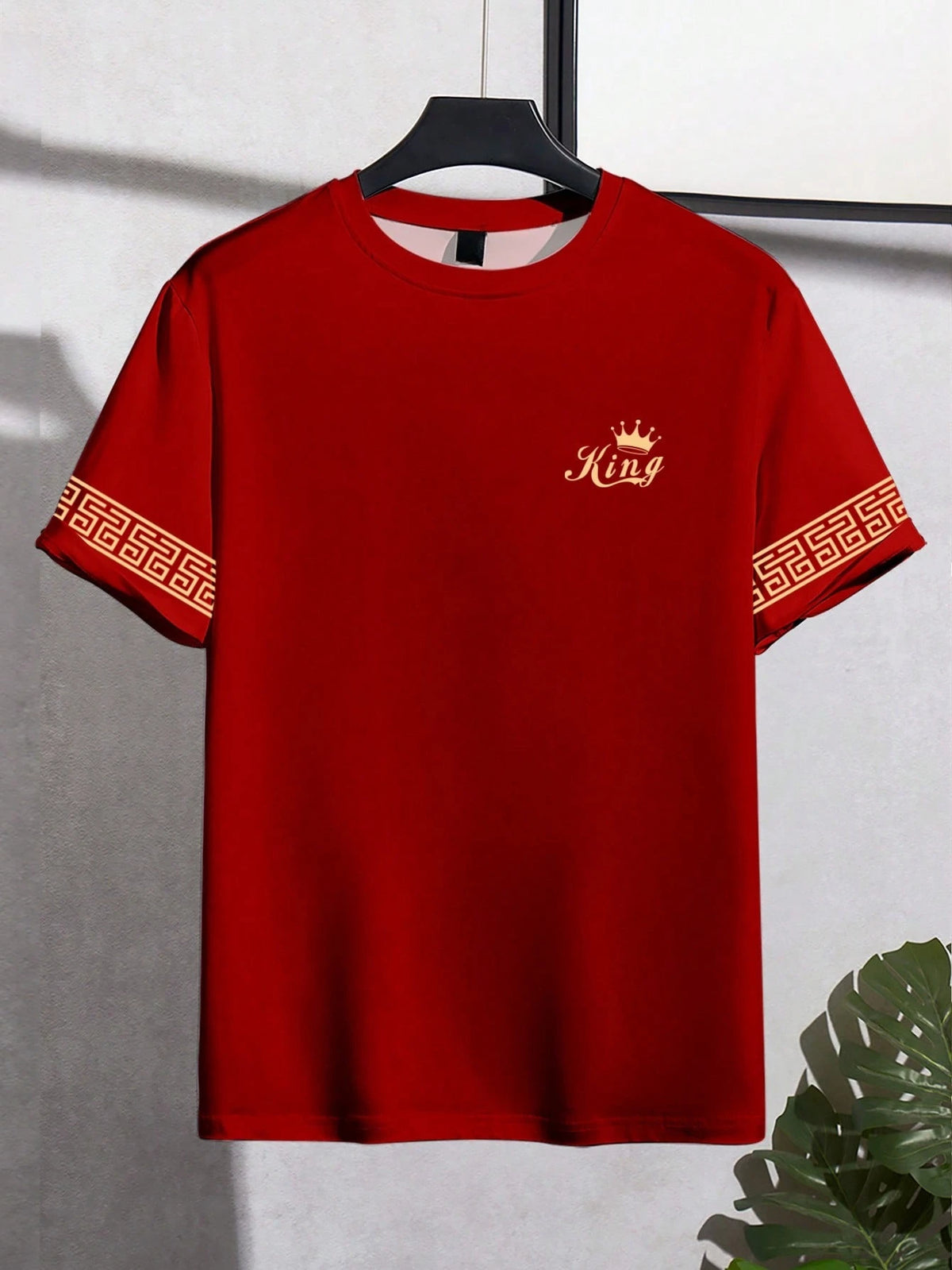 Black men's T-shirt with gold "King" print, casual style, by Corporación Turística, featuring a comfortable fit and informal design.