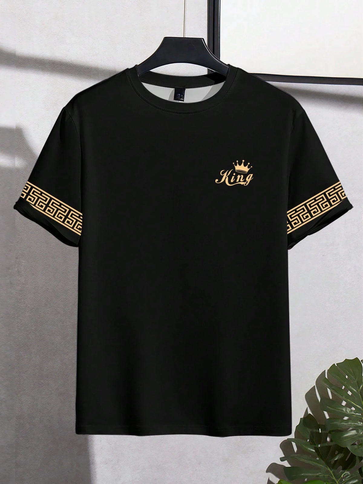 Black men's "King" T-shirt by Corporación Turística with gold print, casual style, short sleeves, and crew neck.