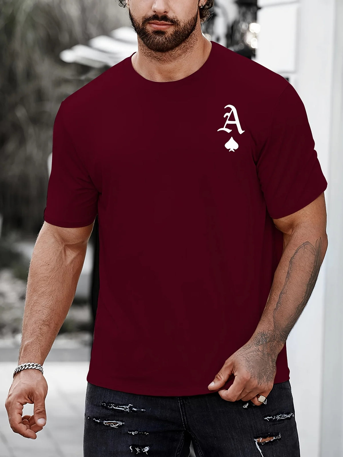 Black men's "King" T-shirt by Corporación Turística with gold print, casual style, featuring a bold graphic design.
