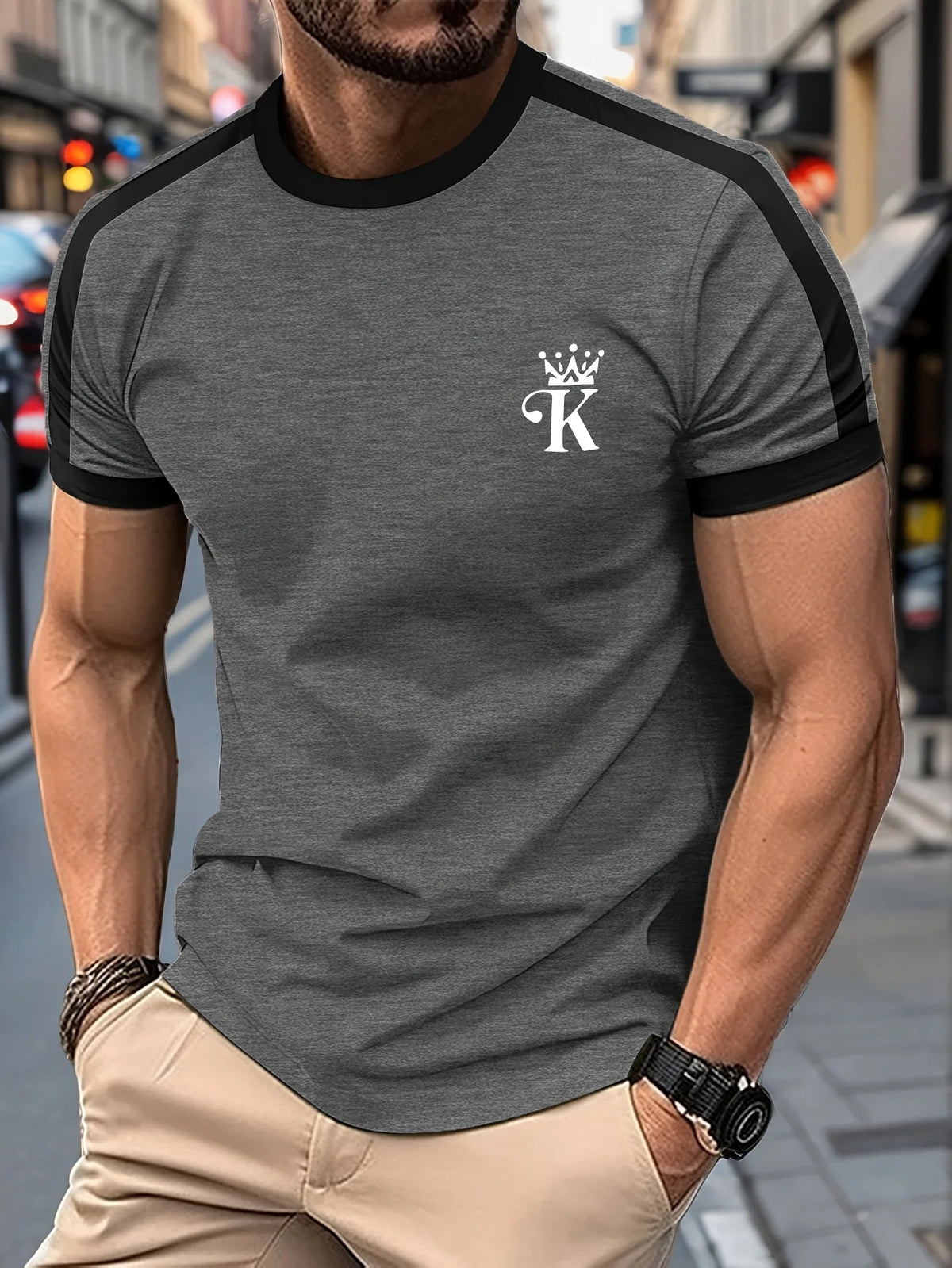 Black men's T-shirt "King" by Corporación Turística with gold print, casual style, short sleeves, and crew neck.