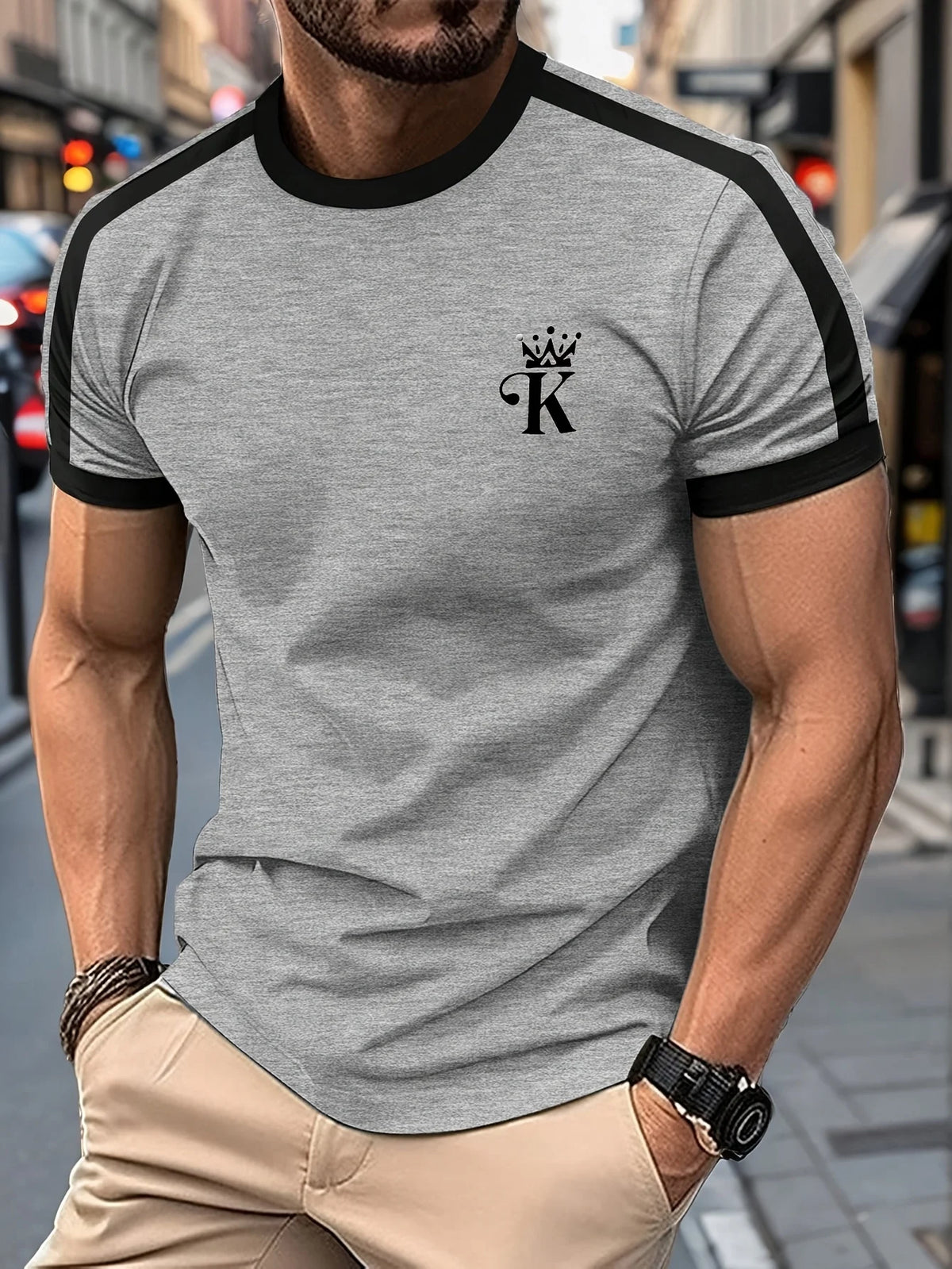 Black men's "King" T-shirt by Corporación Turística with gold print, casual style, featuring a graphic design on the front.