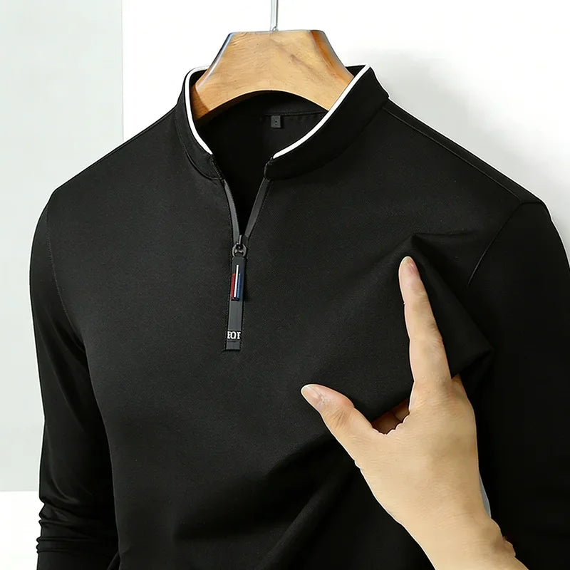 Men's long sleeve black polo shirt with half zipper from Corporación Turística, casual and business style, anti-wrinkle fabric.