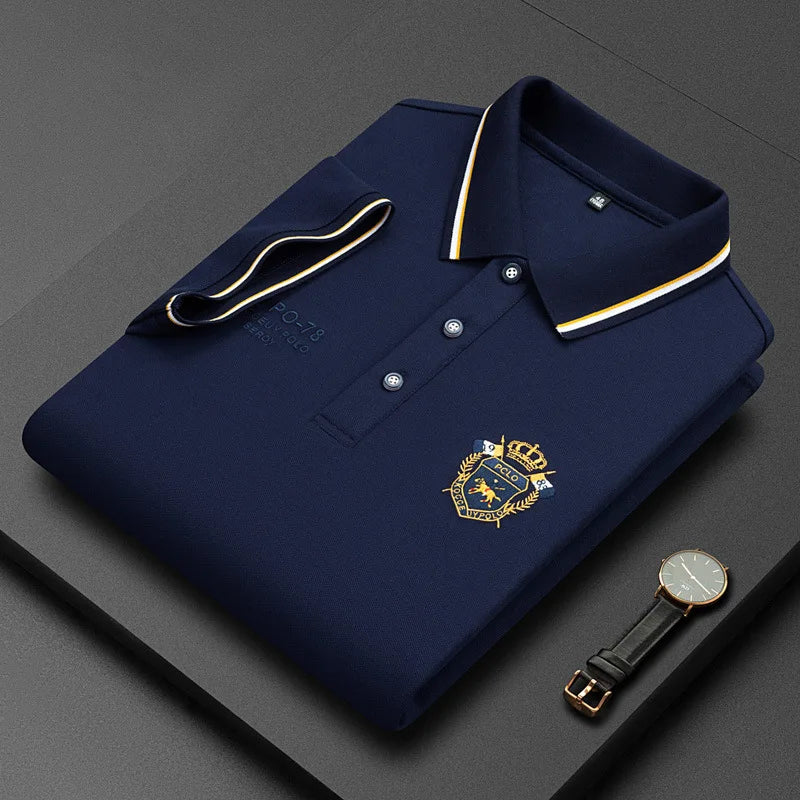 Light blue embroidered cotton polo shirt for men by Corporación Turística, casual summer style, breathable fabric.