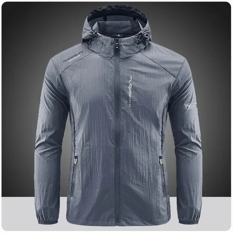 Light grey men's UPF50+ quick-dry sports jacket from Corporación Turística, ideal for hiking and cycling, shown on a model.