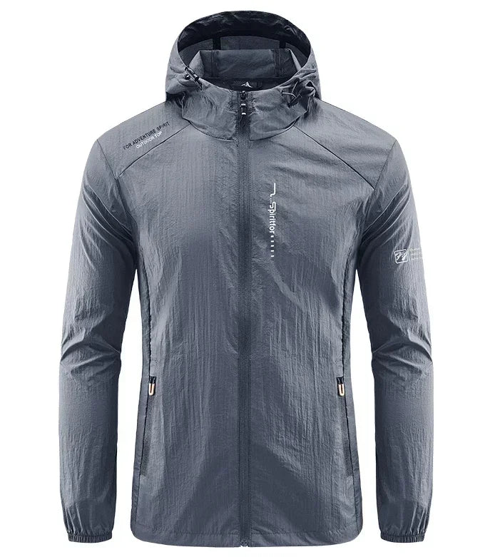 Light grey men's UPF50+ quick-dry hiking and cycling jacket from Corporación Turística, suitable for outdoor sports and solar protection.