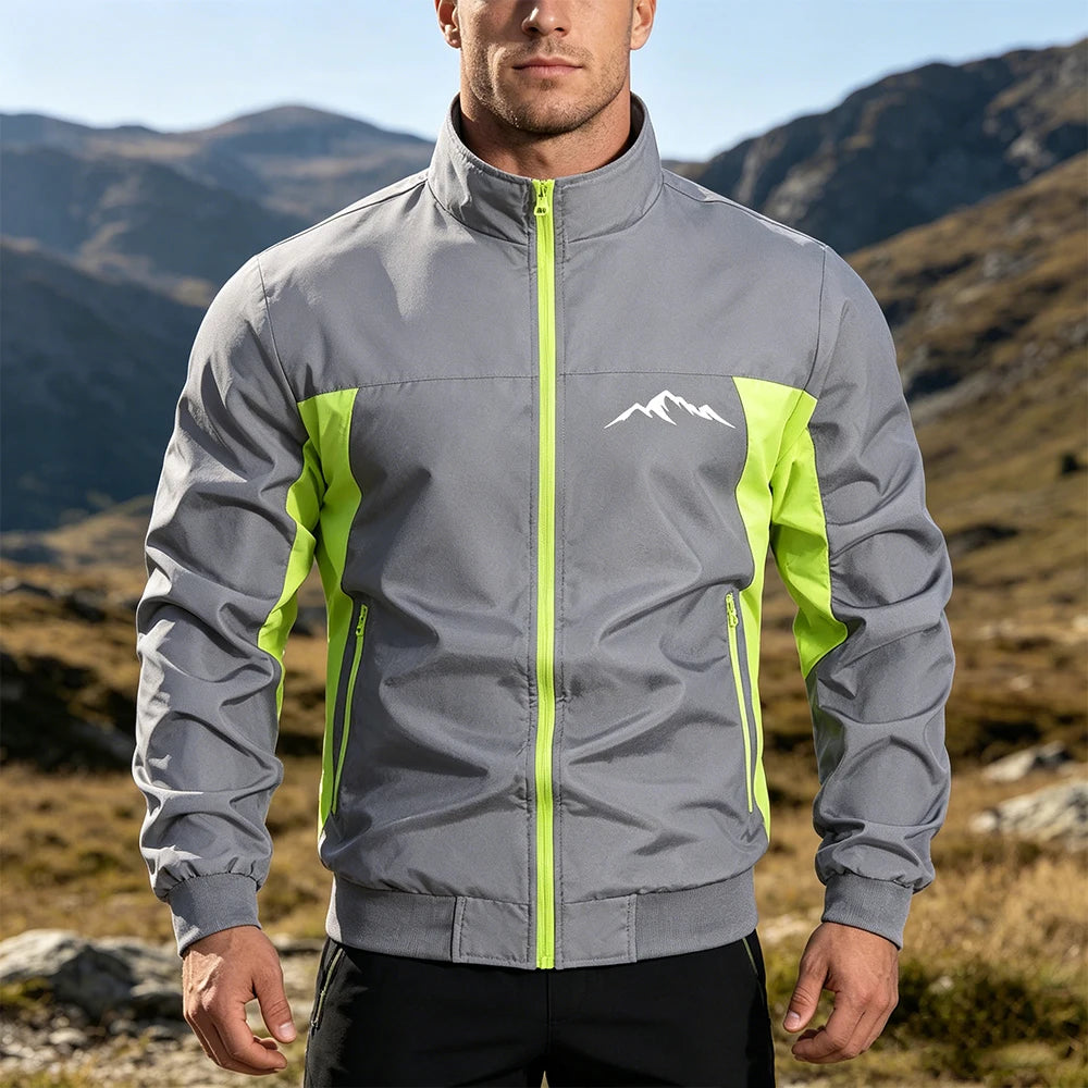 Navy blue and green men's windbreaker jacket by Corporación Turística, outdoor mountain style, suitable for gym and running.