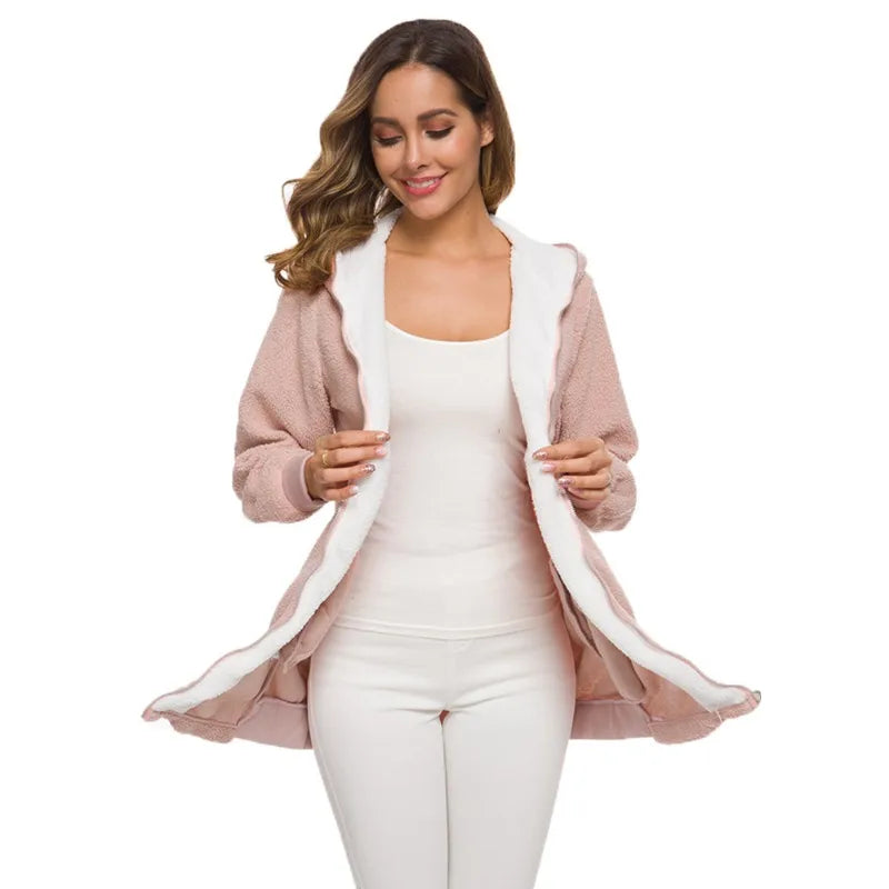 Pink women's cardigan and faux leather jacket from Corporación Turística, featuring a cozy knit design and stylish fit.