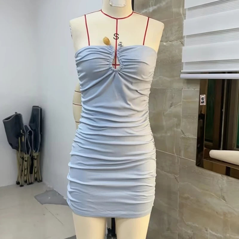 Elegant sleeveless minivestido for women in pink by Corporación Turística, showcased on a model.