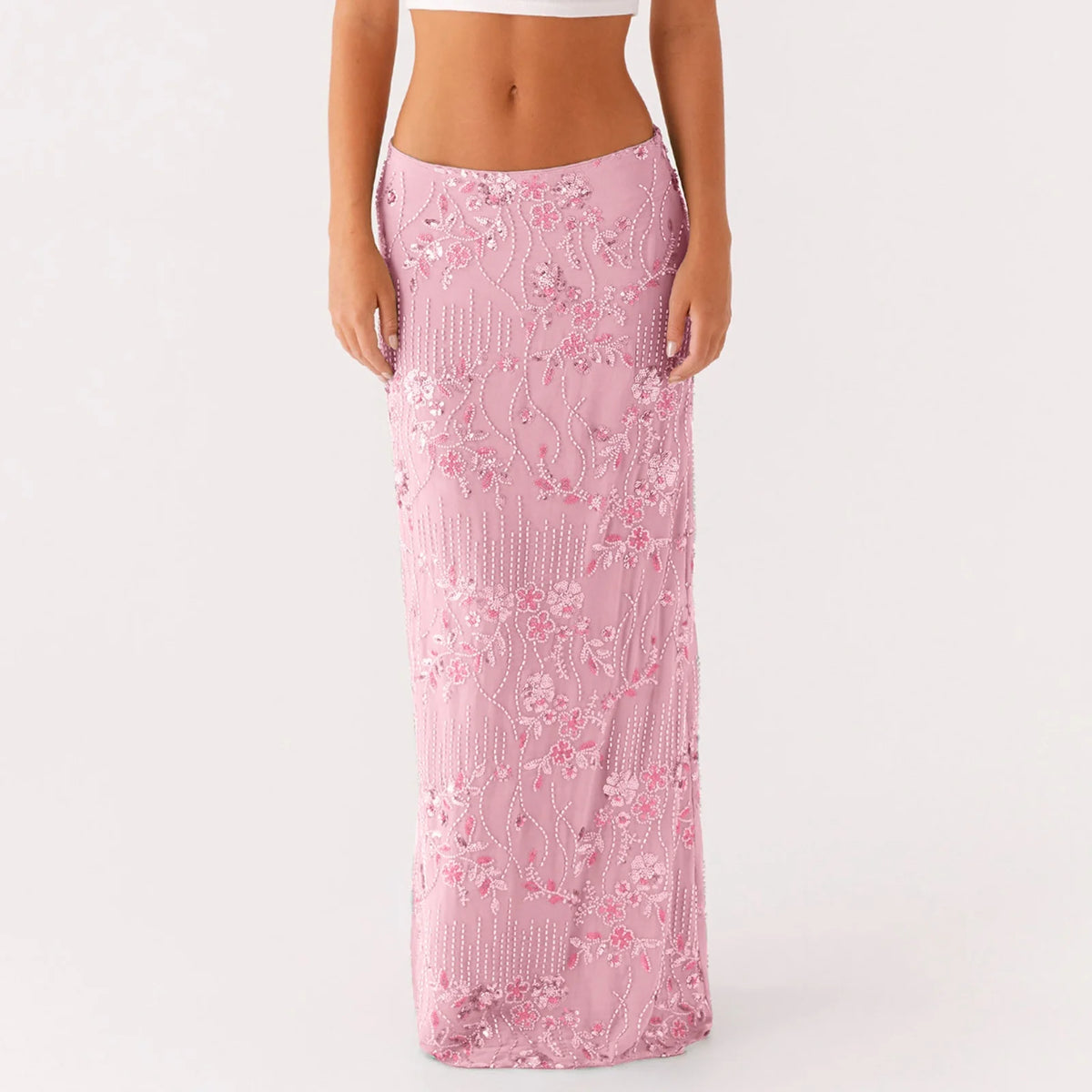 Elegant long pink skirt for women with sequins and bead embellishments, designed by Corporación Turística.